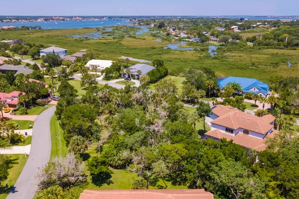 an aerial view of residential houses with outdoor space