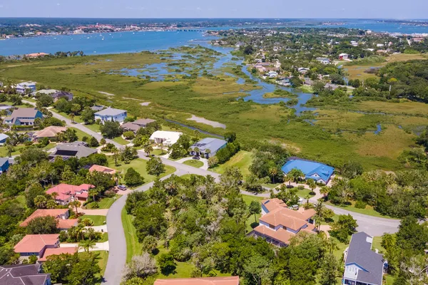 an aerial view of residential houses with outdoor space