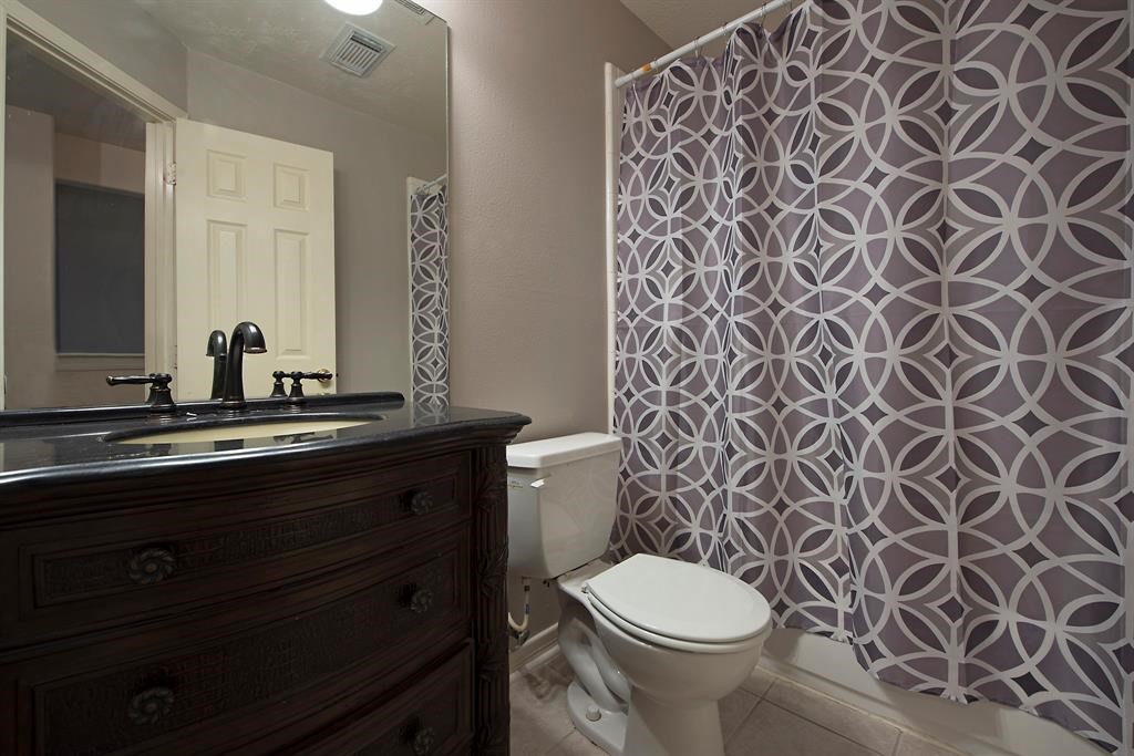 18923 Crescent Fountain Road Spring, TX 77388 - Photo 25 of 27 Upstairs bathroom with tub and shower.