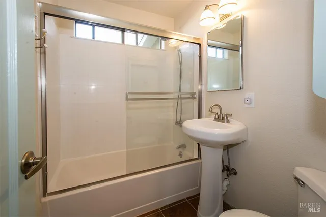a bathroom with a sink and mirror