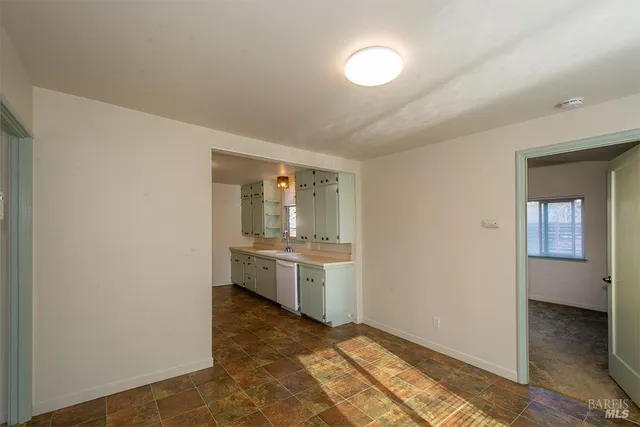 a room with a sink and a mirror