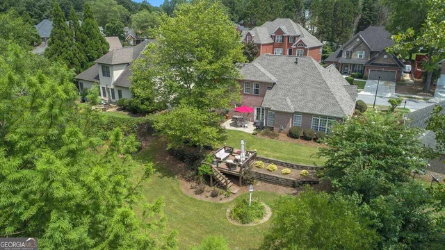 a aerial view of a house with table and chairs and potted plants