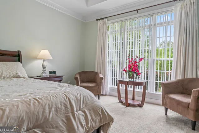 a bedroom with a bed and a couch