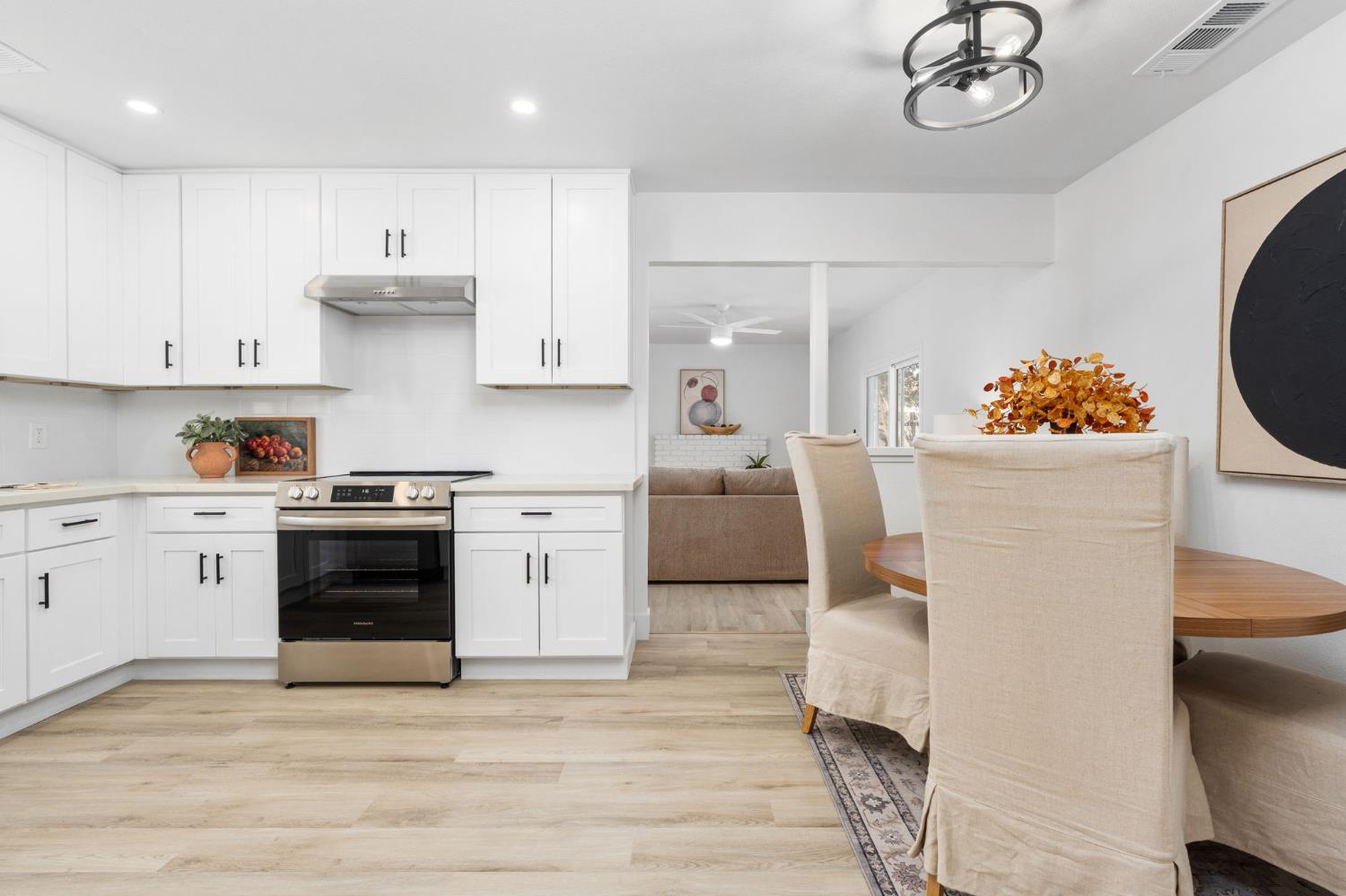 801 West Santa Ana Avenue Clovis, CA 93612 - Photo 12 of 32 a kitchen with a white stove top oven and refrigerator