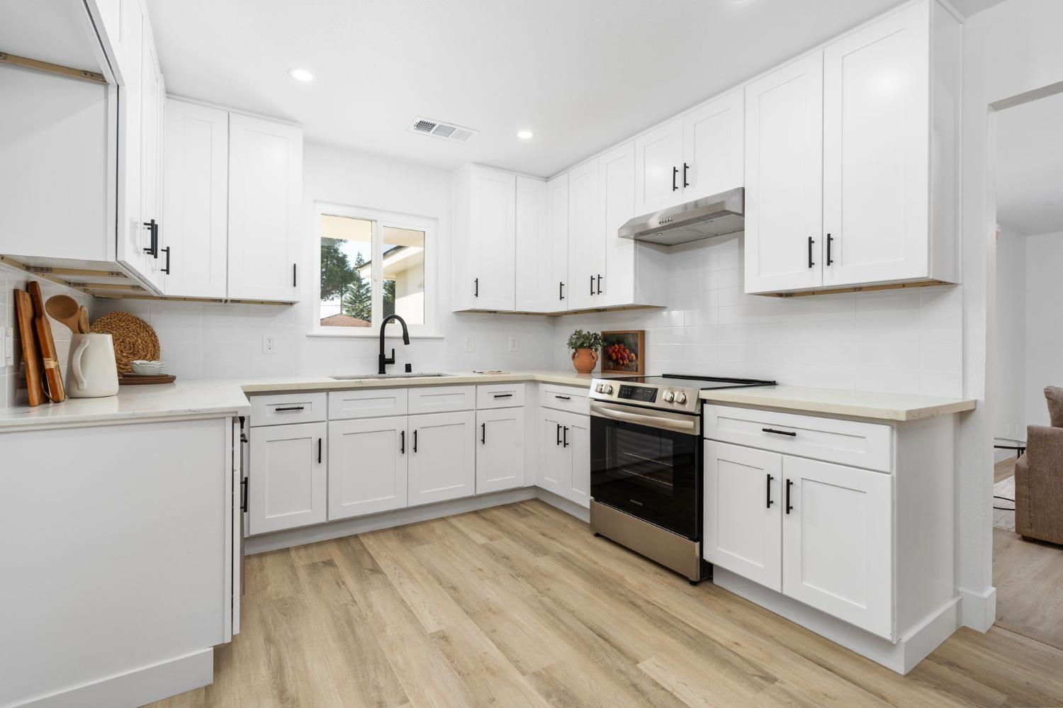 801 West Santa Ana Avenue Clovis, CA 93612 - Photo 14 of 32 a kitchen with cabinets appliances and a window