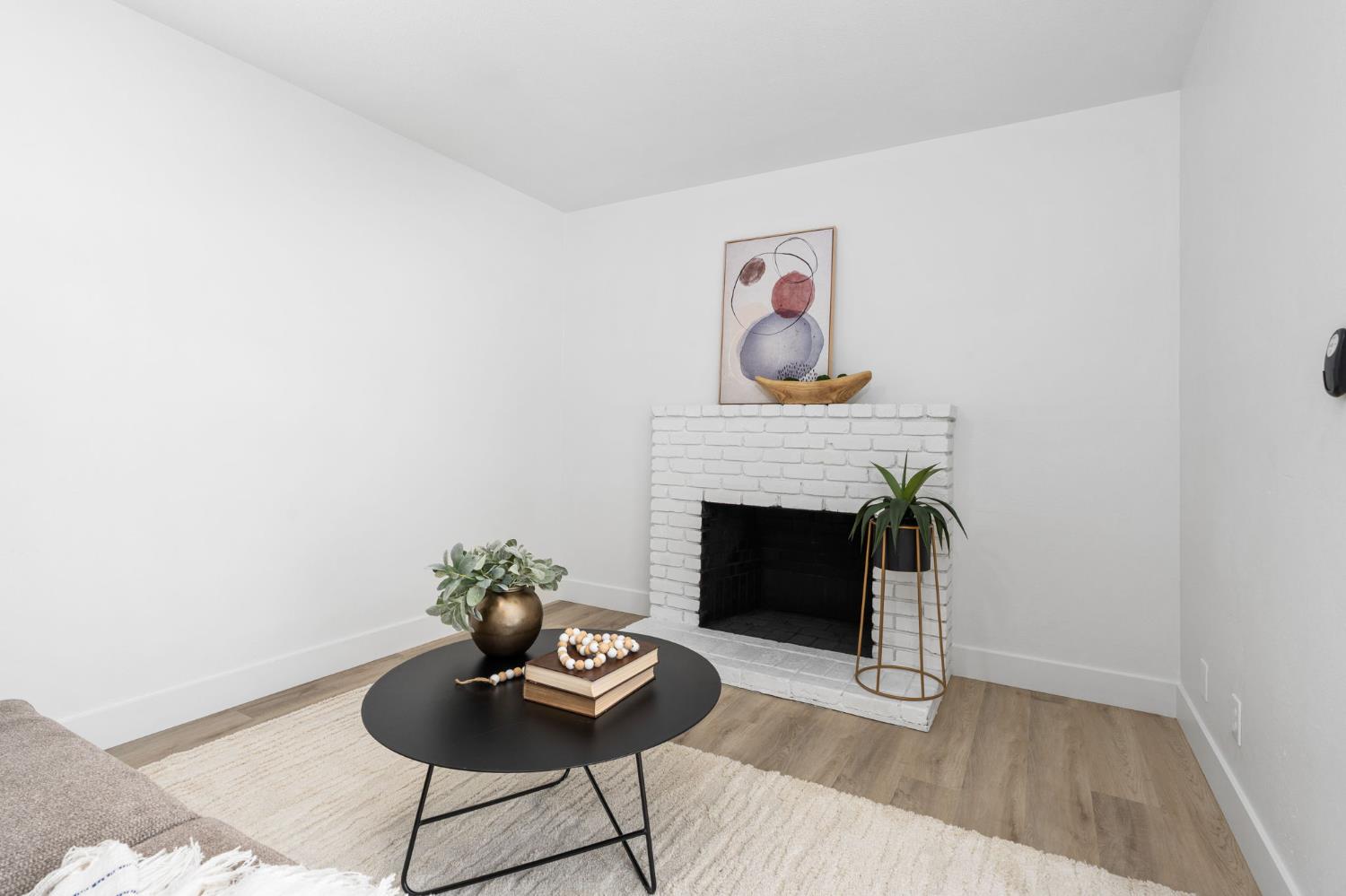 801 West Santa Ana Avenue Clovis, CA 93612 - Photo 19 of 32 a living room with furniture and a fireplace