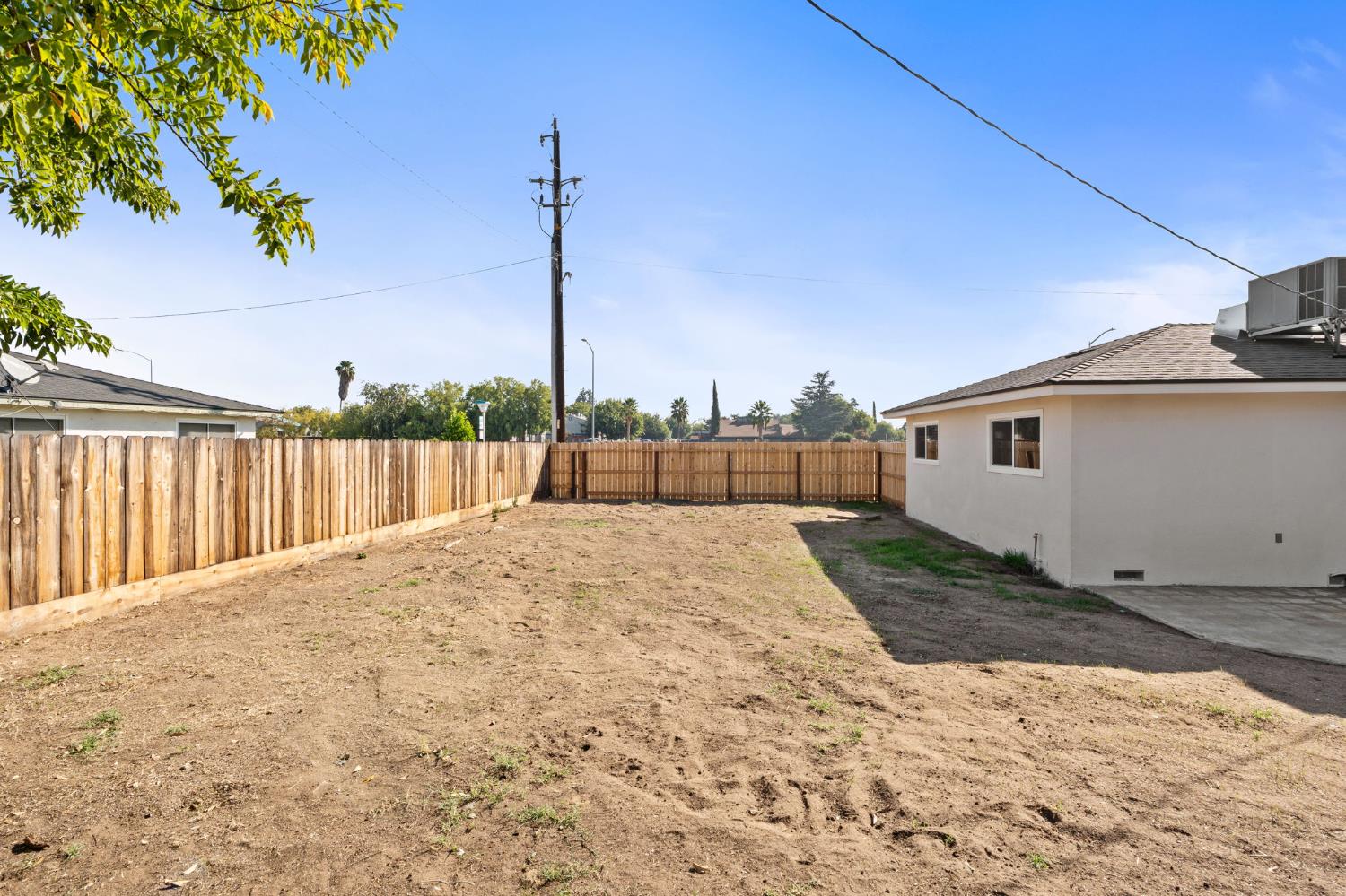 801 West Santa Ana Avenue Clovis, CA 93612 - Photo 29 of 32 a view of a house with a yard
