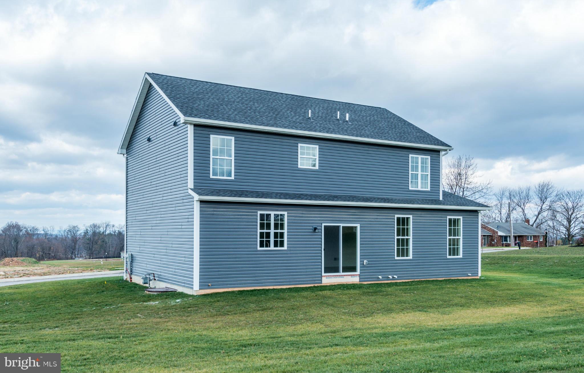 1194 Bair Road, Unit 39 Hanover, PA 17331 - Photo 12 of 12 a front view of a house with a yard