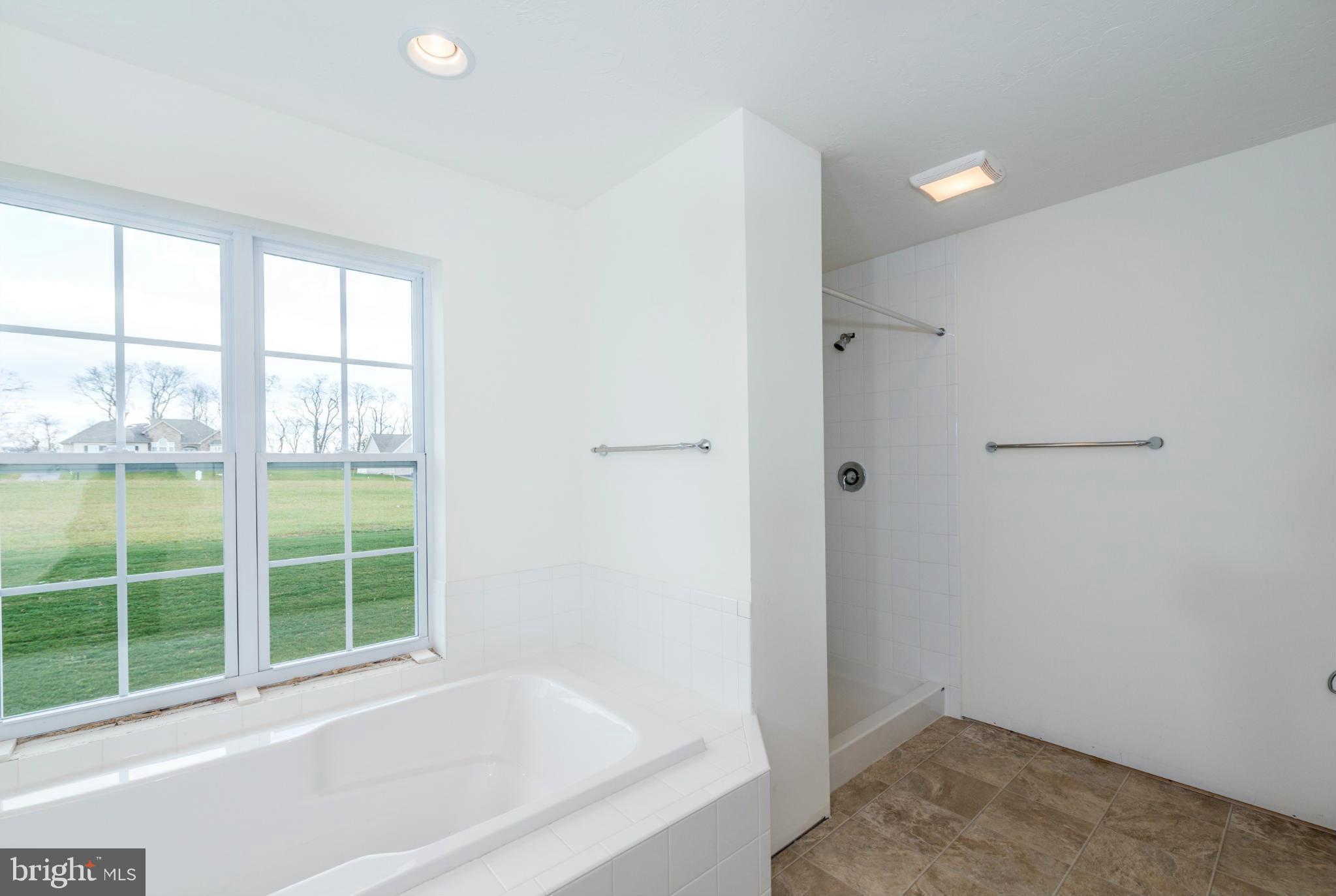 1194 Bair Road, Unit 39 Hanover, PA 17331 - Photo 5 of 12 a bathroom with a bathtub and a window