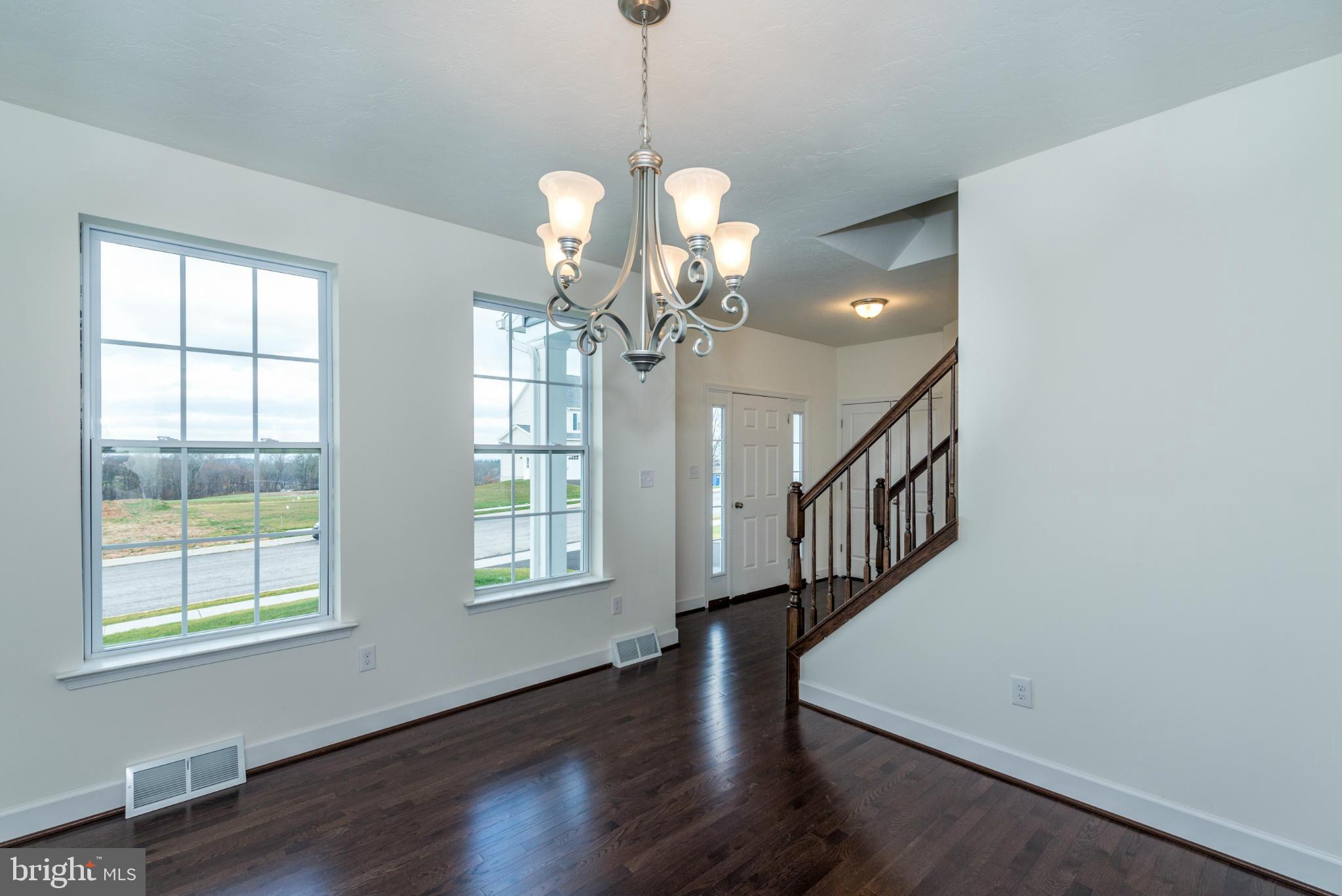 1194 Bair Road, Unit 39 Hanover, PA 17331 - Photo 10 of 12 a view of a livingroom with a window and wooden floor