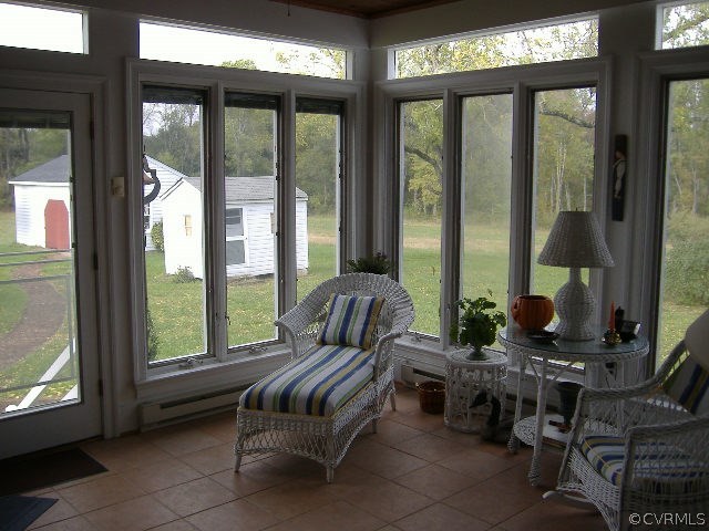 3170 Duke Road Powhatan, VA 23139 - Photo 18 of 27 Cheerful sun room has tile flooring, casement wind