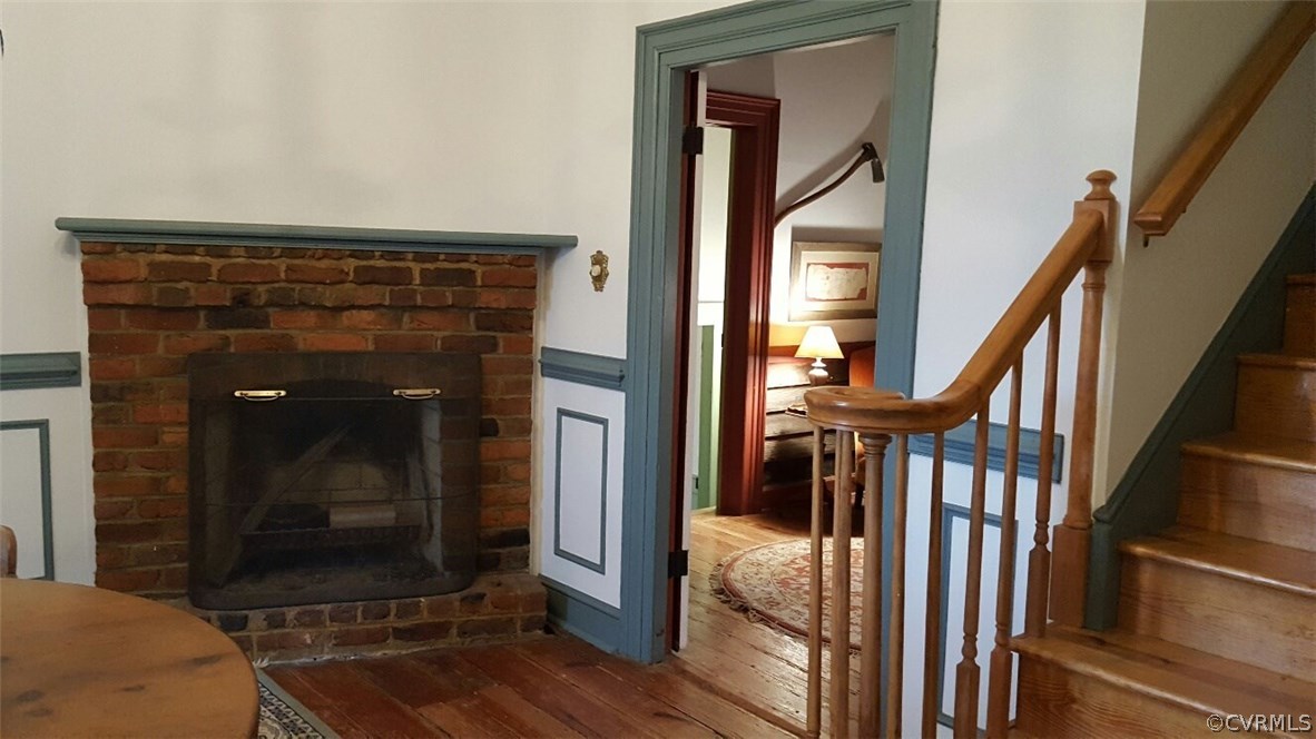 3170 Duke Road Powhatan, VA 23139 - Photo 7 of 27 Dining room has brick fireplace, staircase to seco