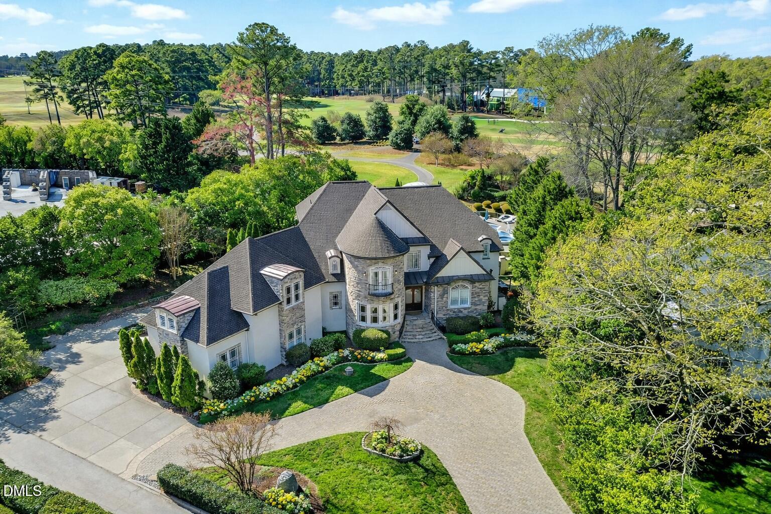 6701 Foxfire Place Raleigh, NC 27615 - Photo 2 of 67 an aerial view of a house with a big yard plants and large trees