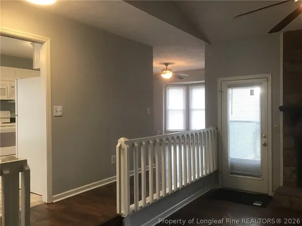 a view of entryway with wooden floor