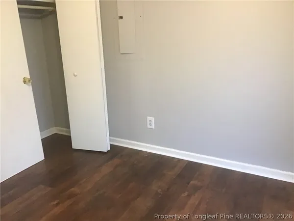 an empty room with wooden floor