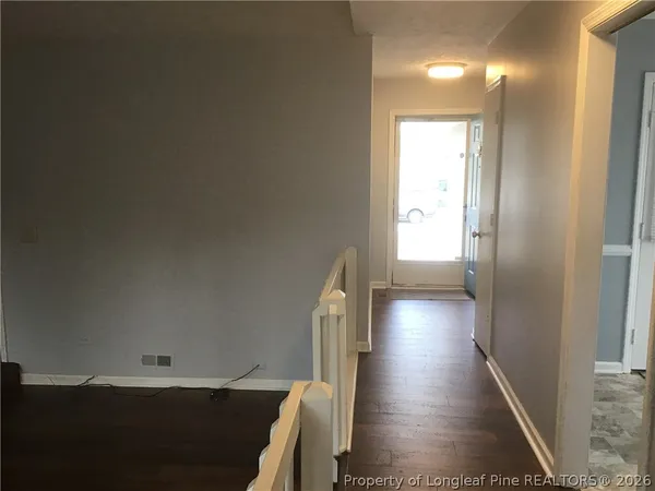 a view of gallery with wooden floor