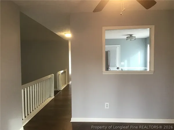 a view of a hallway with windows