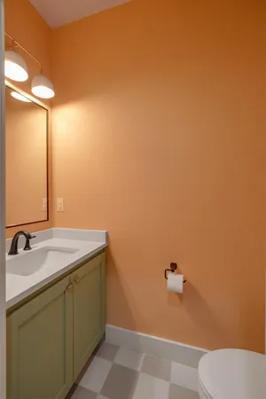 a bedroom with double bunk beds and a window