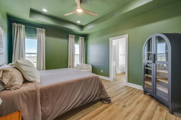 a bedroom with a bed and a couch