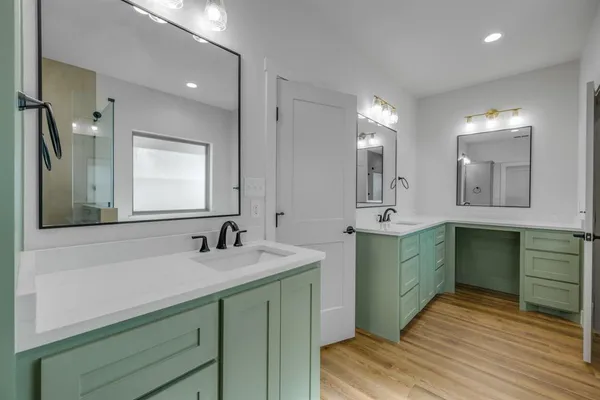 a bathroom with a bathtub and a sink