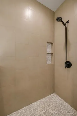 a hallway with a washer and dryer