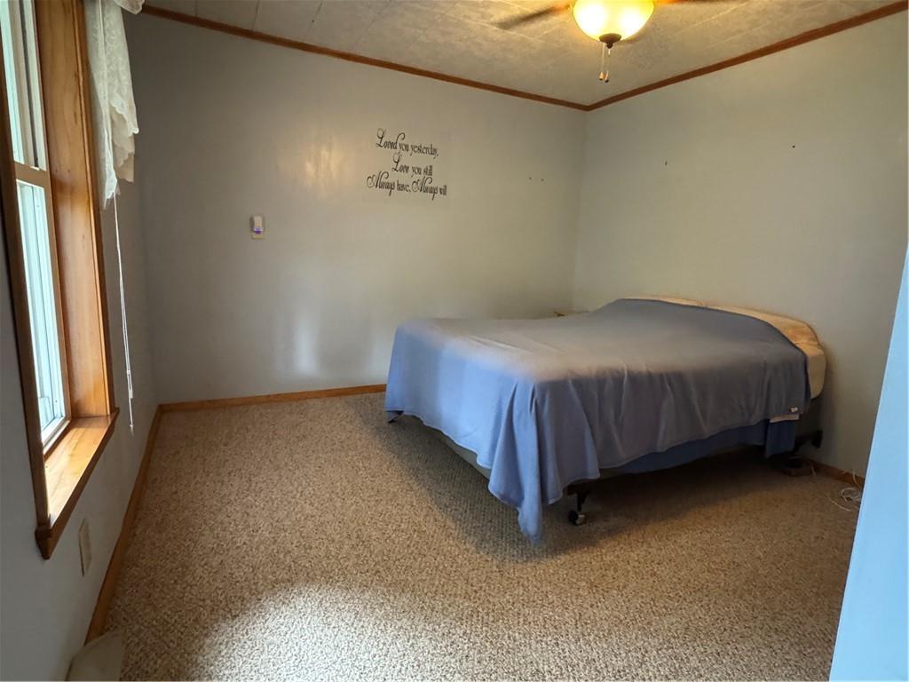 11 Coolspring Street Mercer, PA 16137 - Photo 21 of 30 a bed sitting in a room next to a window