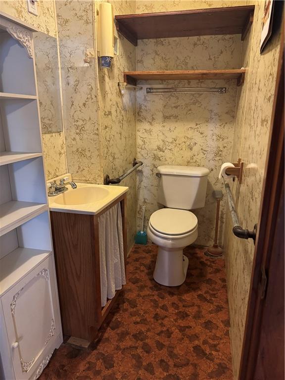 11 Coolspring Street Mercer, PA 16137 - Photo 23 of 30 a bathroom with a sink and a toilet