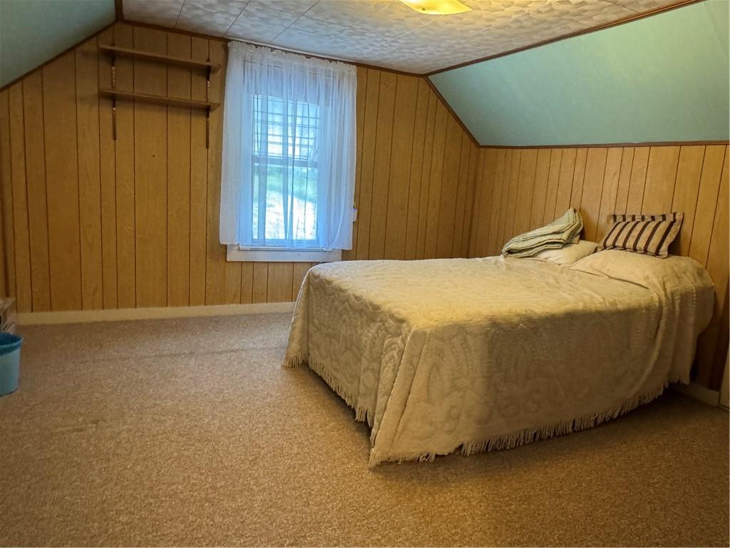 11 Coolspring Street Mercer, PA 16137 - Photo 25 of 30 a bed sitting in a spacious bedroom next to a window