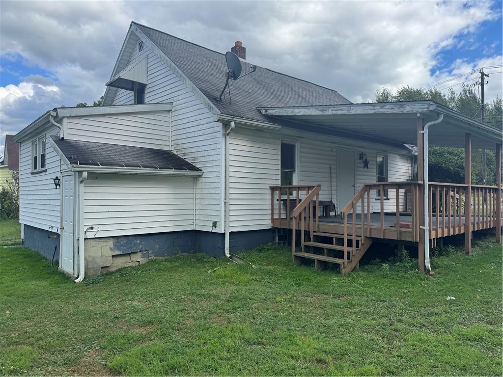 11 Coolspring Street Mercer, PA 16137 - Photo 5 of 30 a backyard of a house with a garden and deck