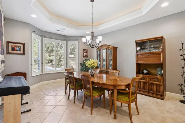 a view of a dining room with furniture window and outside view