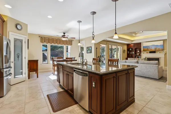 a kitchen with stainless steel appliances granite countertop a stove and a microwave