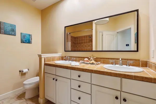 a utility room with sink dryer and washer