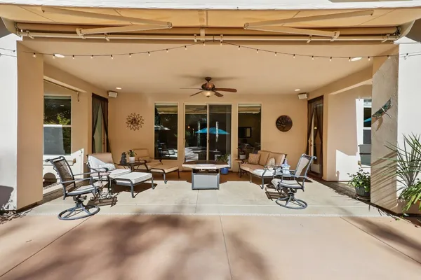 an aerial view of a house with outdoor space