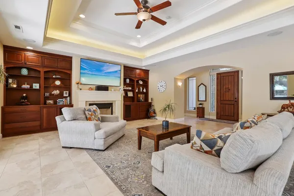 a living room with furniture and a fireplace