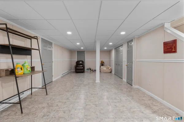 a view of a hallway with seating area