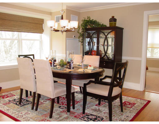 12 Russell Road, Unit 202 Wellesley, MA 02482 - Photo 1 of 15 a view of a dining room with furniture window and wooden floor