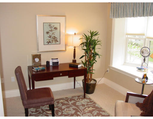 12 Russell Road, Unit 202 Wellesley, MA 02482 - Photo 11 of 15 a living room with furniture and a potted plant