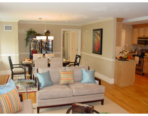 12 Russell Road, Unit 202 Wellesley, MA 02482 - Photo 2 of 15 a living room with furniture and a flat screen tv