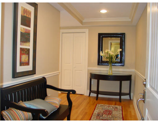 12 Russell Road, Unit 202 Wellesley, MA 02482 - Photo 3 of 15 a bedroom with a bed and a window