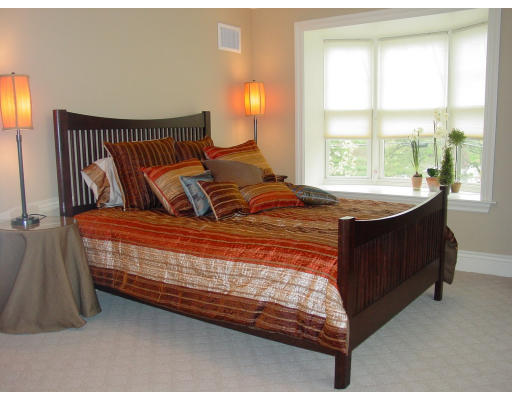 12 Russell Road, Unit 202 Wellesley, MA 02482 - Photo 7 of 15 a bedroom with a bed and window