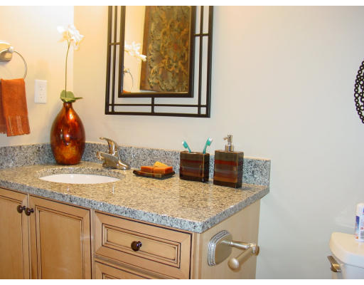 12 Russell Road, Unit 202 Wellesley, MA 02482 - Photo 10 of 15 a kitchen with granite countertop a sink and a window