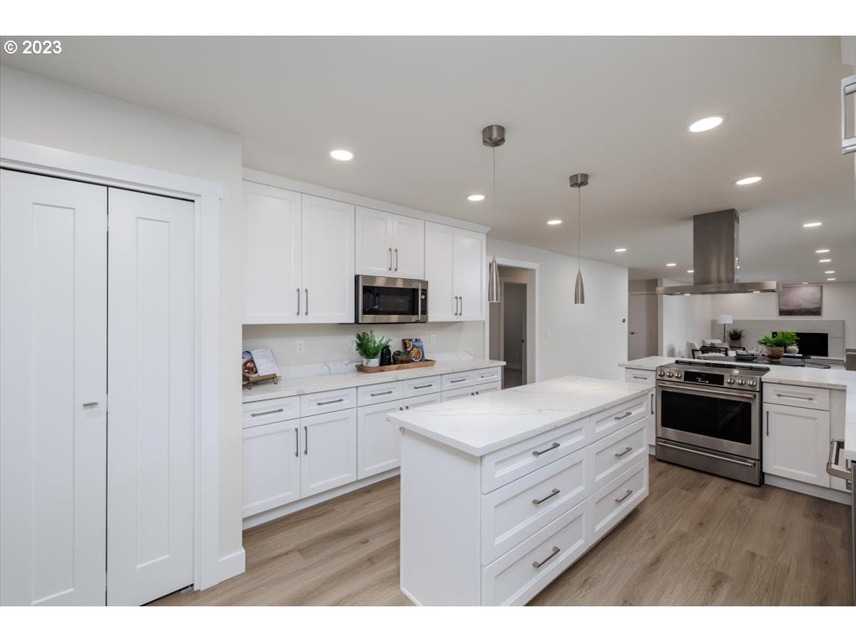 4011 Southwest 43rd Avenue Portland, OR 97221 - Photo 14 of 46 a kitchen with a sink stainless steel appliances and cabinets