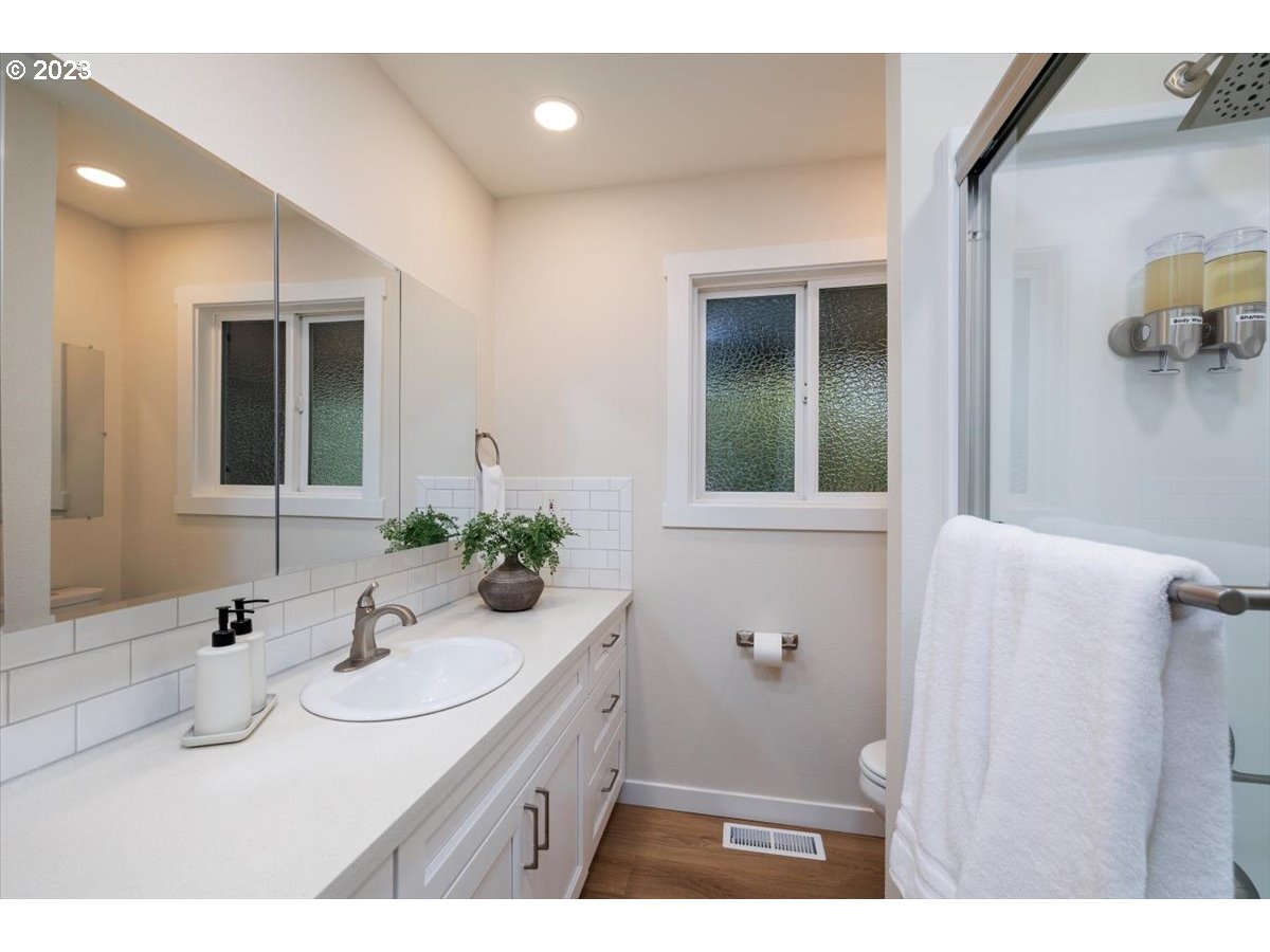 4011 Southwest 43rd Avenue Portland, OR 97221 - Photo 19 of 46 a bathroom with a sink and a mirror