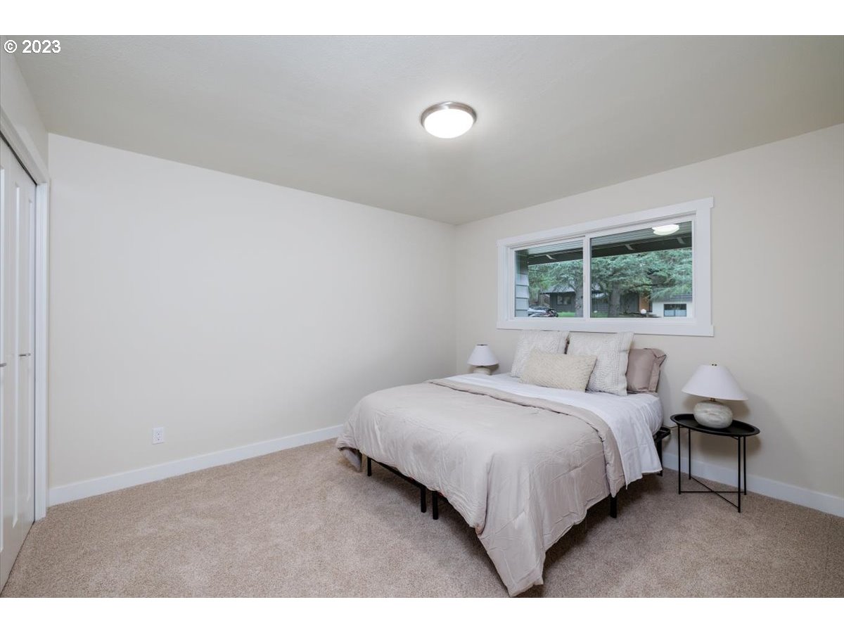 4011 Southwest 43rd Avenue Portland, OR 97221 - Photo 20 of 46 a bedroom with a bed and a window