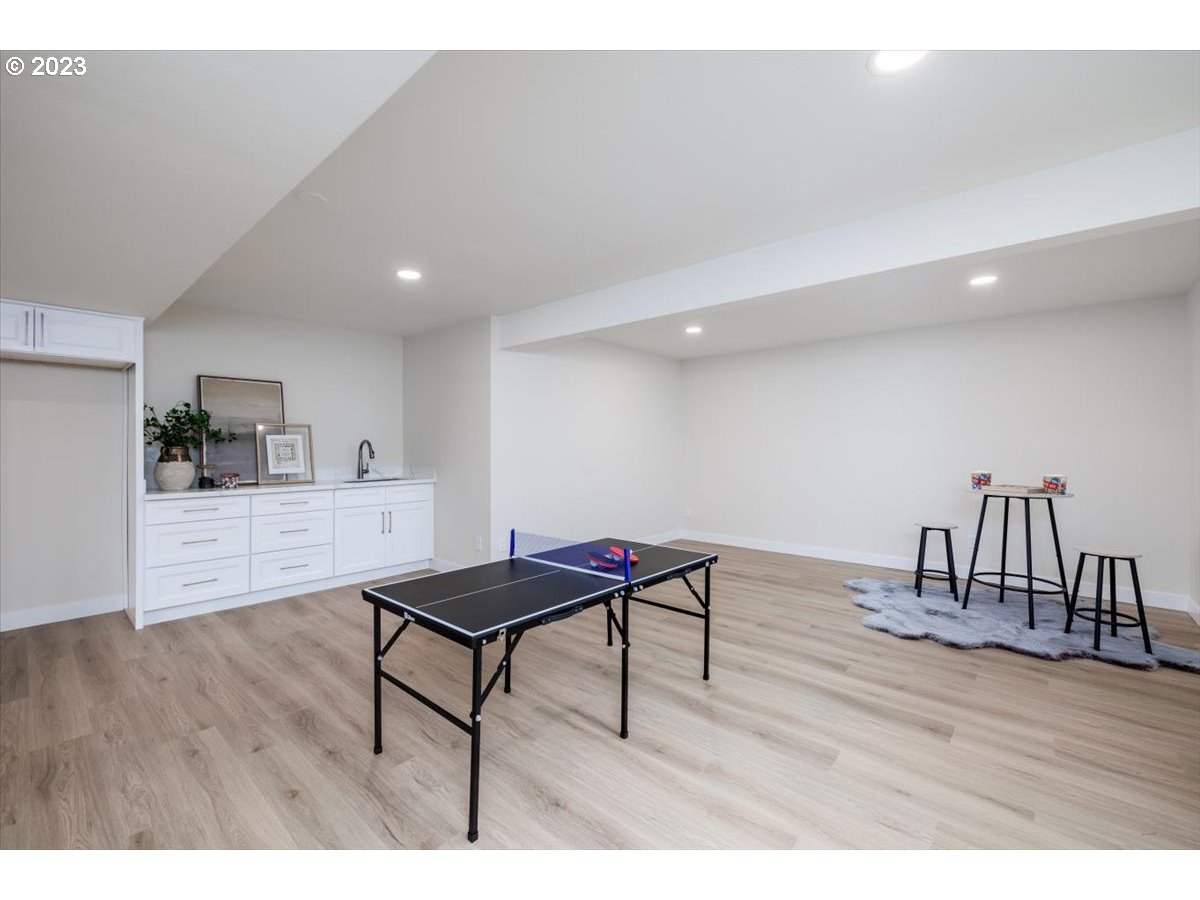 4011 Southwest 43rd Avenue Portland, OR 97221 - Photo 25 of 46 a living room with furniture and a wooden floor