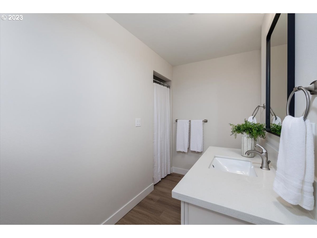 4011 Southwest 43rd Avenue Portland, OR 97221 - Photo 30 of 46 a bathroom with a sink and a mirror