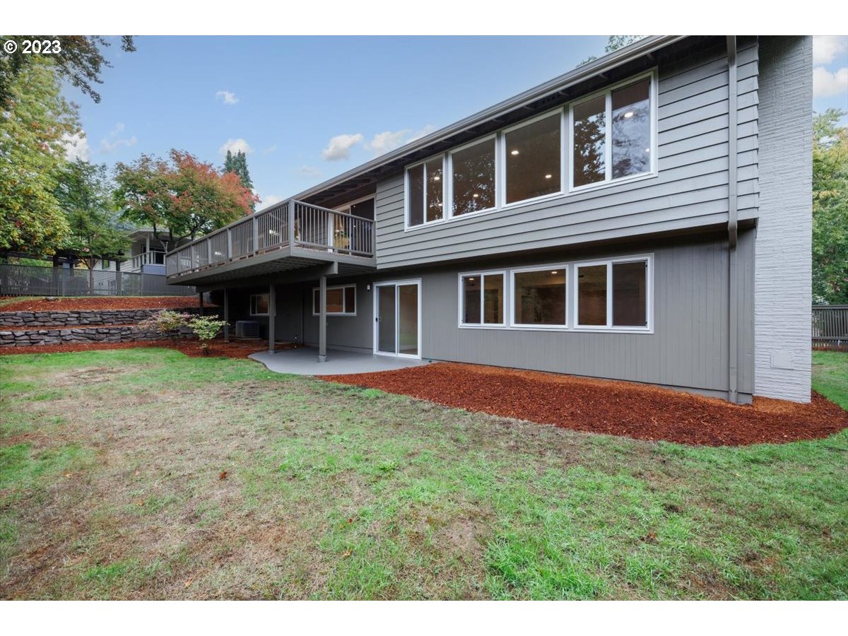 4011 Southwest 43rd Avenue Portland, OR 97221 - Photo 37 of 46 a backyard of a house with yard barbeque oven and outdoor seating