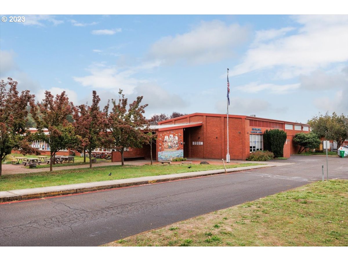 4011 Southwest 43rd Avenue Portland, OR 97221 - Photo 43 of 46 a front view of a house with a yard and garage