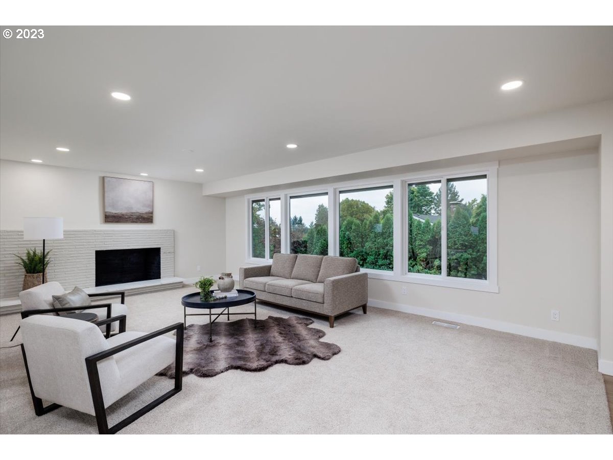 4011 Southwest 43rd Avenue Portland, OR 97221 - Photo 7 of 46 a living room with furniture and a flat screen tv