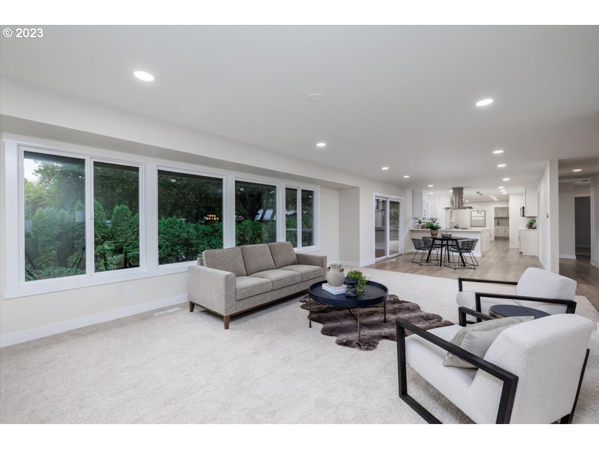 4011 Southwest 43rd Avenue Portland, OR 97221 - Photo 9 of 46 a living room with furniture and a large window